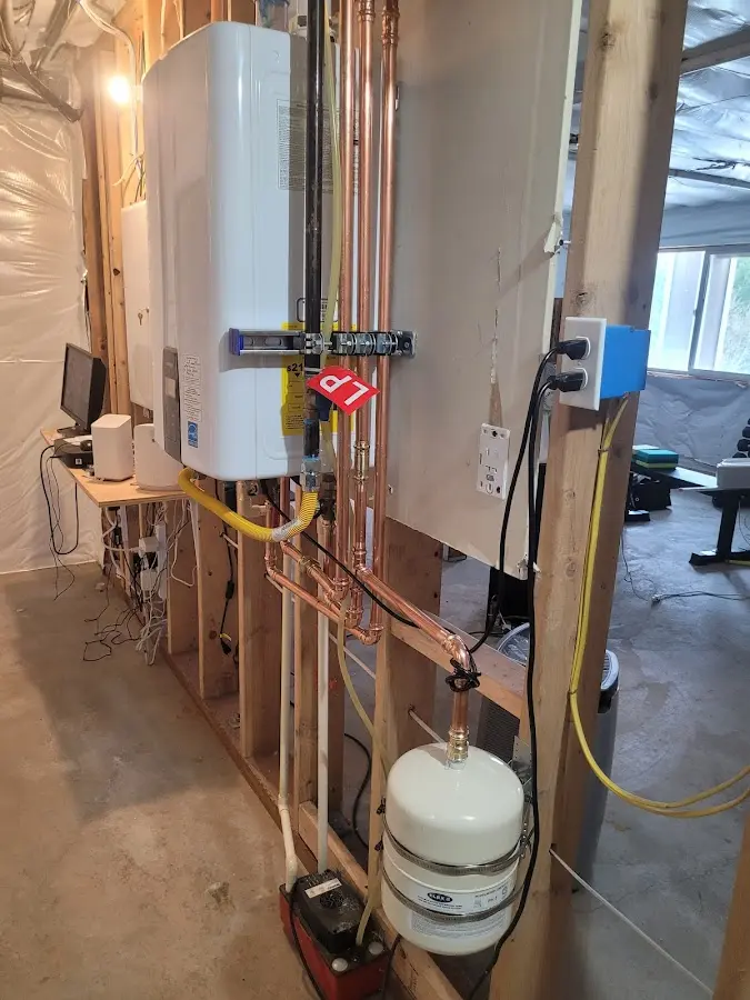 Licensed plumber repairing a kitchen sink in Hardwick